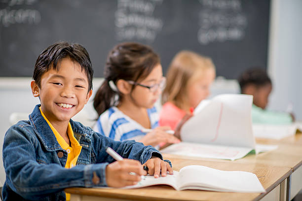 istock Little Boy Happily Finishing an Assignment 501513052