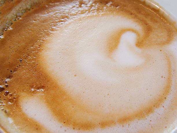 istock White Cup with a gourmet coffee and foam figure 501513190
