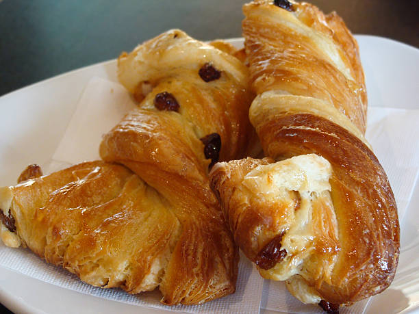 Sweet pastries, flaky croissants with Golden raisins