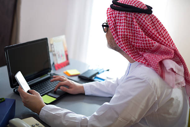 istock Portrait of a smart arabic business man using laptop 501514178