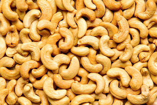 istock Nuts Cashews are scattered as a background 501514490