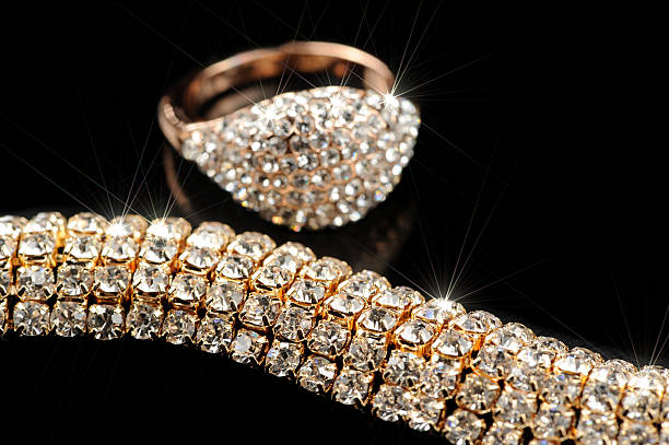 istock Shiny Gold Ring and Necklace on Black Background 501514839