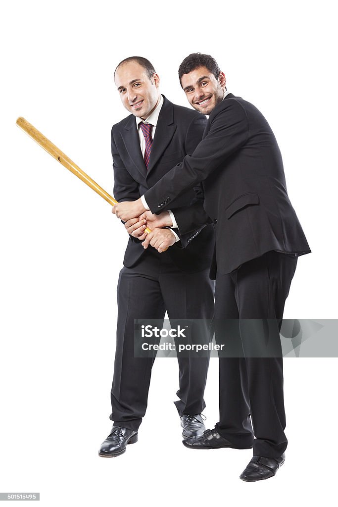 good teamwork Two Businessman standing on a white background holding together a baseball bat Men Stock Photo