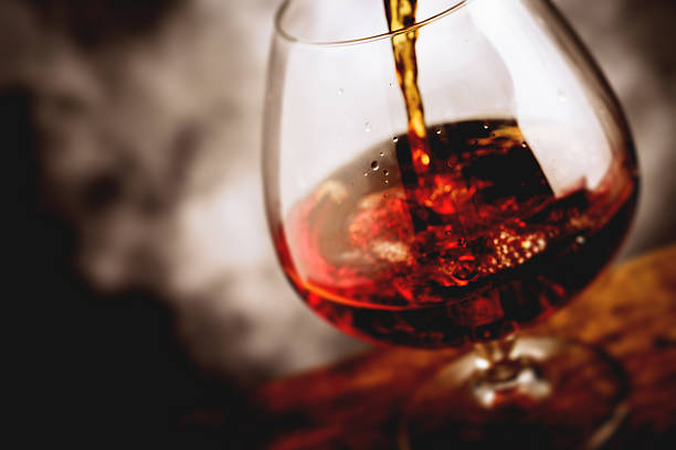 bourbon glass - tilt shift selective focus stock photo