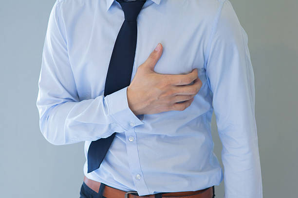 istock Man having heart-attack / chest pain in isolated background 501517238
