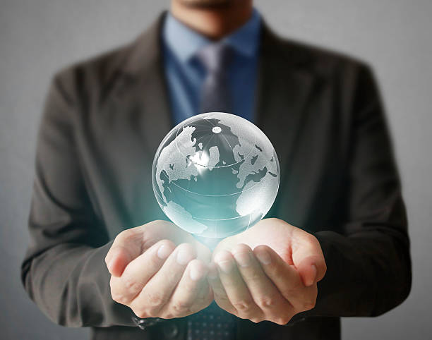 istock holding a glowing earth globe in his hands 501517548