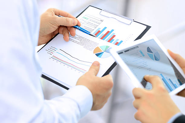 istock Business colleagues working together and analyzing financial figures 501519496