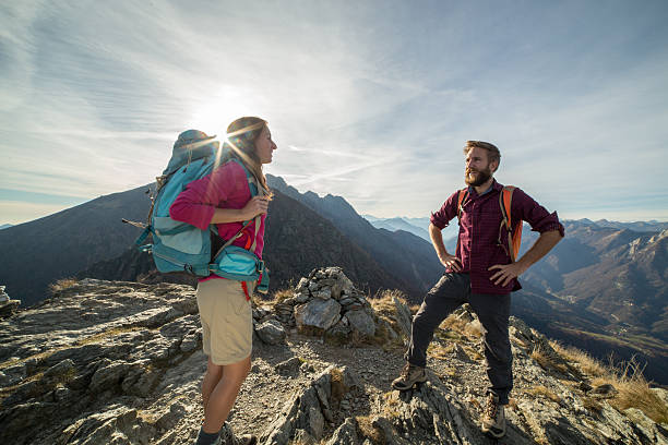 istock Couple of young hikers on mountain top 501520026