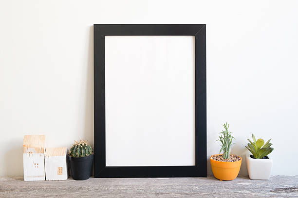 istock mockup of blank frame poster on wall 501520550