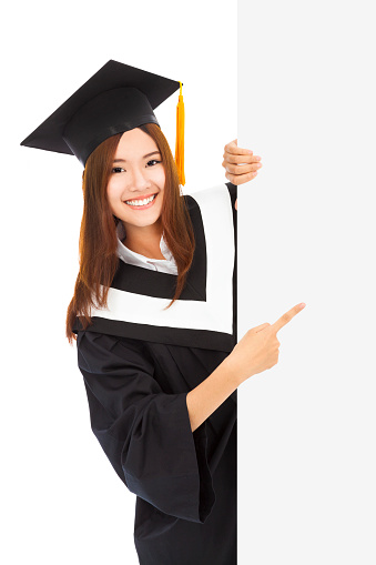 young female graduation students point to  blank board over white background
