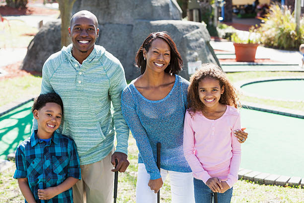 istock Family playing miniature golf 501532053