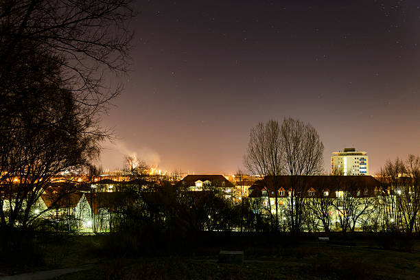 View on Eisenhuettenstadt at night. Planned city created in 1950 . In the left background the steelworks. Long exposure 15 seconds, ISO 1250, visible noise. Eisenhuettenstadt, Brandenburg, Germany