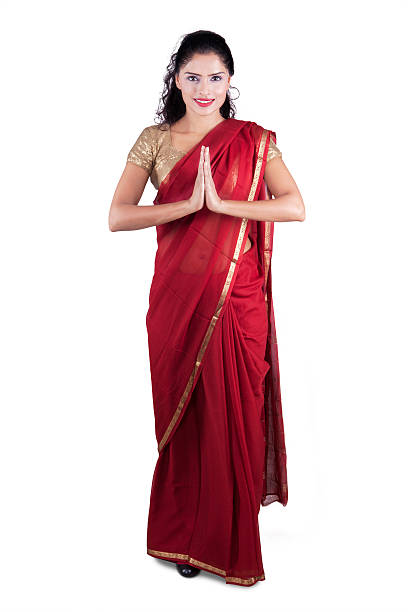 istock Friendly indian woman shows greeting gesture 501533800