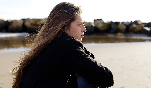 istock Pensive girl feeling sad in winter 501534074