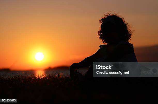 Relaxing Young Child In Sunset Stock Photo - Download Image Now - Adult, Adults Only, Agricultural Field