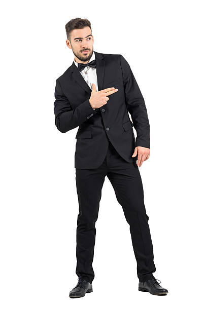 istock Funny secret agent with finger gun hand gesture looking away 501534796