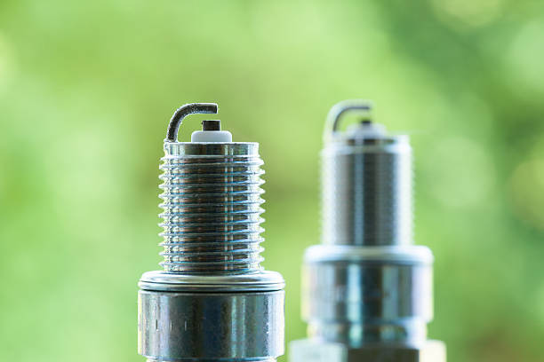istock Auto service. Two new spark plugs  spare part of car. 501534889