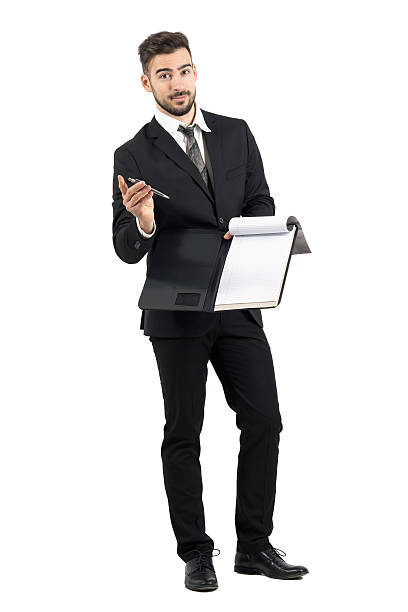 istock Salesman in suit giving contract and pencil looking at camera 501534890