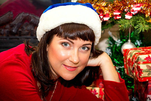 istock Young beautiful woman in santa hat. 501536452