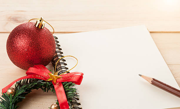 istock Empty paper note with Christmas balls on wooden background,Chris 501536752