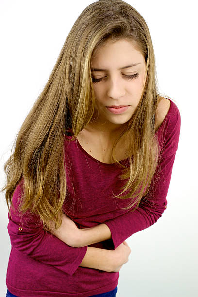 istock Female teenager with strong stomach menstruation problem 501538636