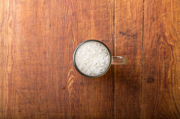 glass of fresh lager beer on wooden table