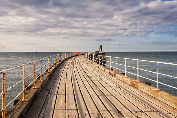 whitby west pier stock photo