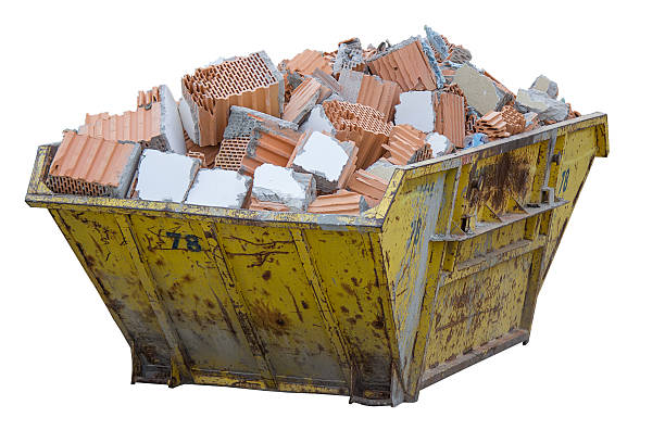 construction waste container full of material from demolished wa Construction waste container full of material from demolished walls. Isolated on white with clipping path. rubble photos stock pictures, royalty-free photos & images