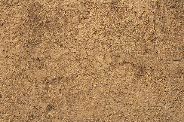 istock Texture of old yellow stucco wall 501548175