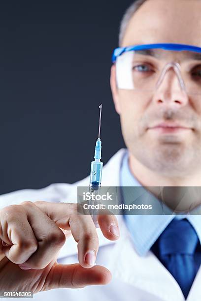 Scientist With Syringe Stock Photo - Download Image Now - 30-39 Years, Adult, Adults Only