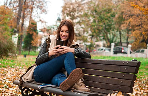 istock Casual woman typing on mobile phone 501548496