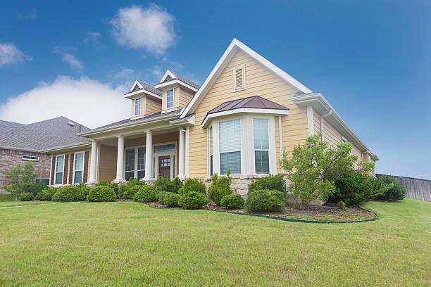 Beautiful newly constructed home with landscaped yard Beautiful newly constructed home with landscaped yard  bay window stock pictures, royalty-free photos & images