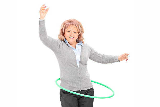 istock Mature woman spinning a hula hoop 501549635