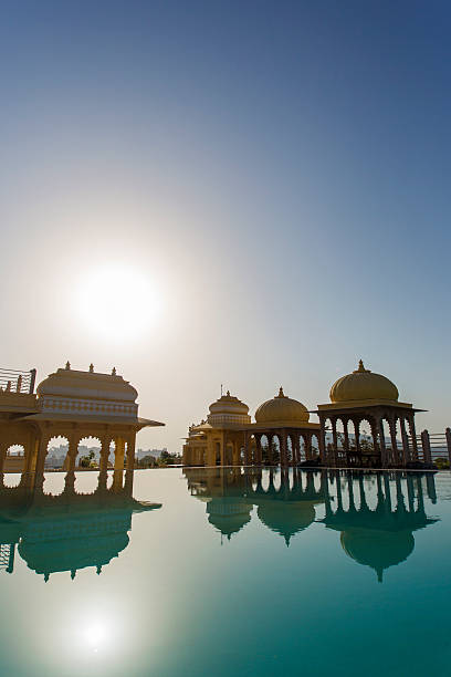 Pool and Architecture Reflection pool with traditional Indian architecture at the Chunda Palace in Udaipur, India udaipur stock pictures, royalty-free photos & images