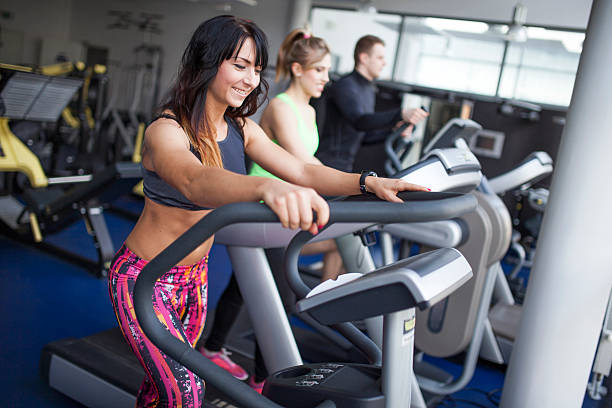 istock Young people in gym - step machine, treadmill 501550249