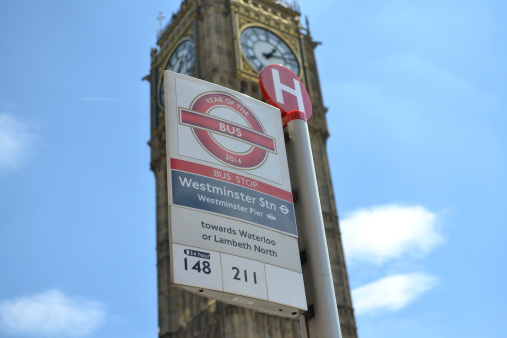 London, United Kingdom - July 3, 2014: Bus stop in London with Big Ben in background.