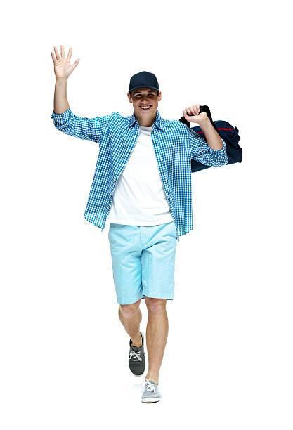 istock Cheerful man walking & waving hand 501553481