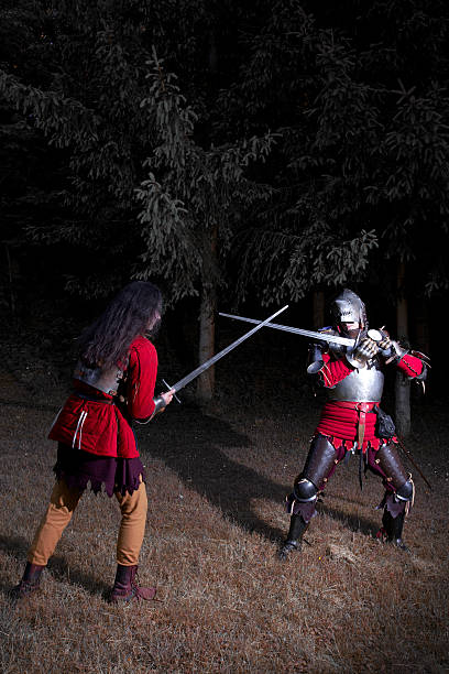 istock Fencing Duel Between Two Knights in Armor in the Forest 501566072
