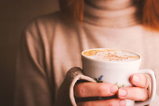 istock Cup of cappuccino in the hands horizontal 501567792