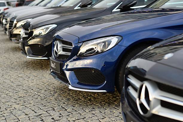 Mercedes-Benz cars in a row Warsaw, Poland - December 1st, 2015: Exposition of Mercedes-Benz cars on the street. These vehicles are the ones of the most popular premium cars in the world. mercedes benz photos stock pictures, royalty-free photos & images