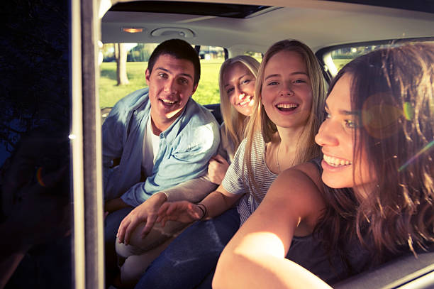 istock Joyful group of friends in a car 501571011