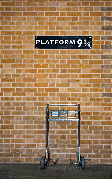 Platform 9 3/4 and Trolley Platform 9 3/4 & Trolley railroad station platform stock pictures, royalty-free photos & images