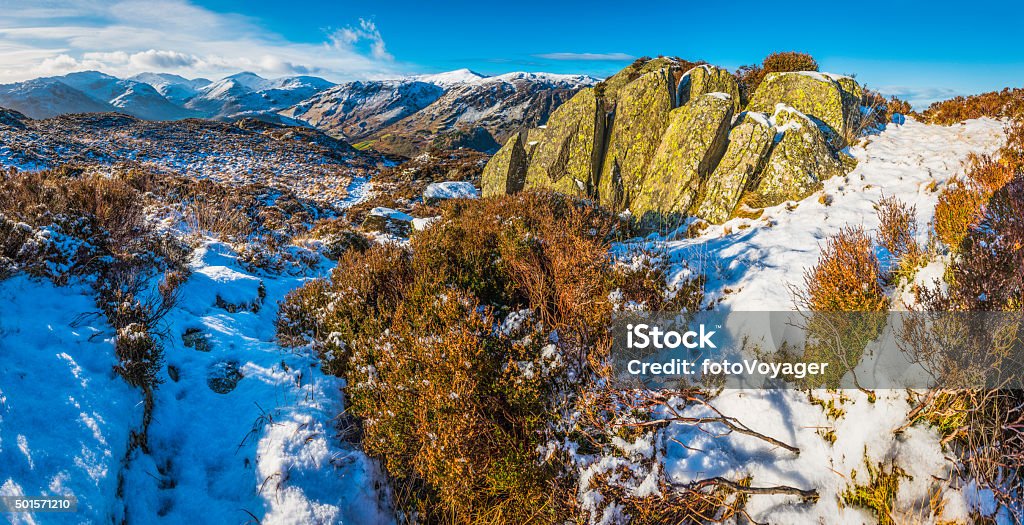 Lake District golden heather crisp white snow mountain fells panorama Rocky mountain tops and snow dusted heather overlooking the tranquil valleys and idyllic landscape of the Lake District National Park, from Watendlath to the high peaks of the Western Fells, Cumbria, UK. Photo RGB profile for maximum color fidelity and gamut. Beauty In Nature Stock Photo