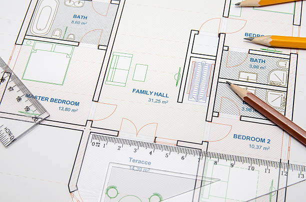 istock Construction planning drawings and three yellow pencils with ruler 501573050