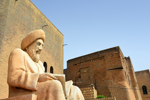 Erbil / Hewler / Arbil / Irbil, Kurdistan, Iraq: statue of the historian Ibn Al-Mustawfi aka Mubarak Ben Ahmed Sharaf-Aldin at the entrance to Arbil Citadel - intelectual and minister of Erbil in the era of Sultan Muzafardin - Qelay Hewlêr - UNESCO world heritage site - photo by M.Torres