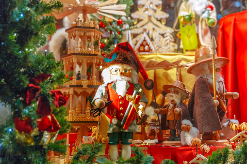 Santa Claus, Christmas tree and toys at a Christmas souvenir  market shop, decorated and illuminated in Bruges, Belgium