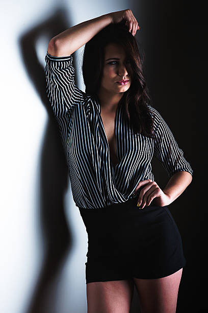 istock Sensual beautiful young woman leaning against wall 501574454