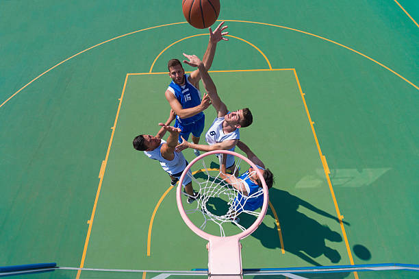 istock Basketball players in the shooting action 501574507