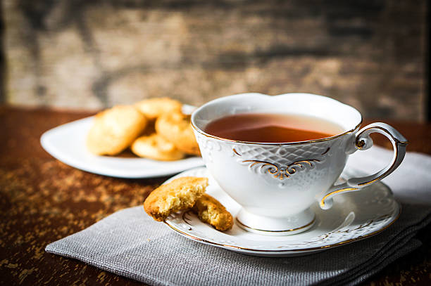 istock Tea with cookies on wooden background 501574837
