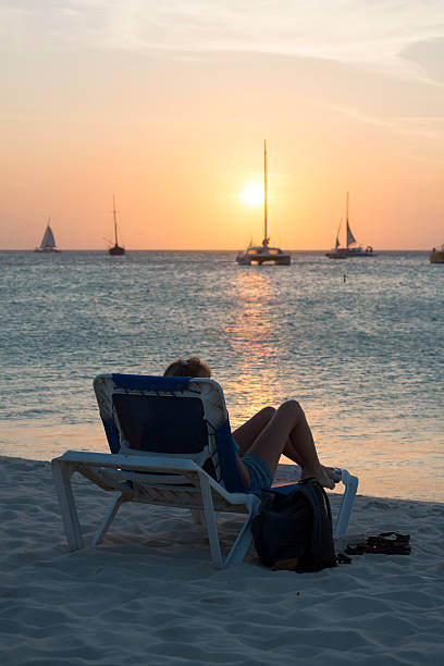 istock Woman watching sunset on Aruba 501577236